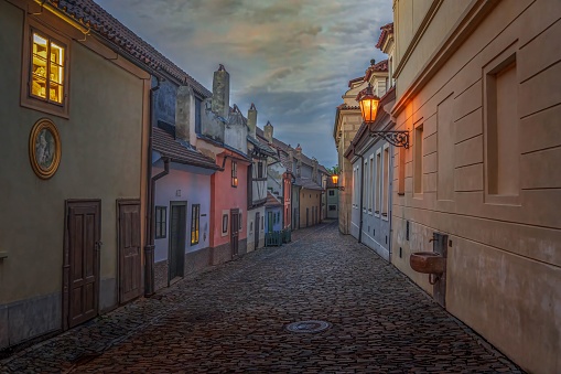 A scenic view of colorful houses of Golden lane in Prague, Czechia at sunset