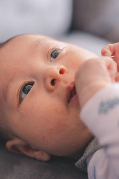 istock Newborn baby face with open eyes 1614417238
