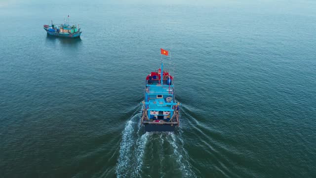 Fishing boat with Vietnamese flags
