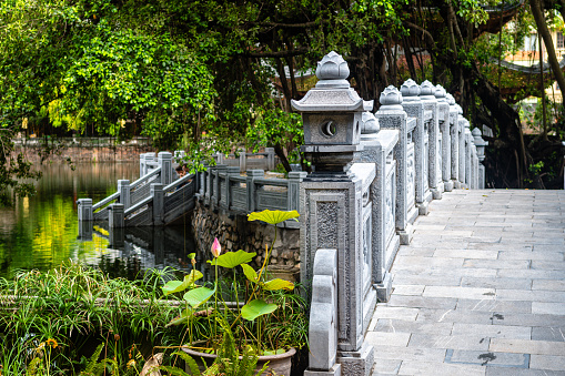 hanoi, vietnam. 5th june, 2023: carved stone bridge in hanoi old quarter, vietnam