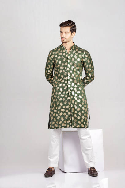 istock Male Model posing in green kurta 1614455595