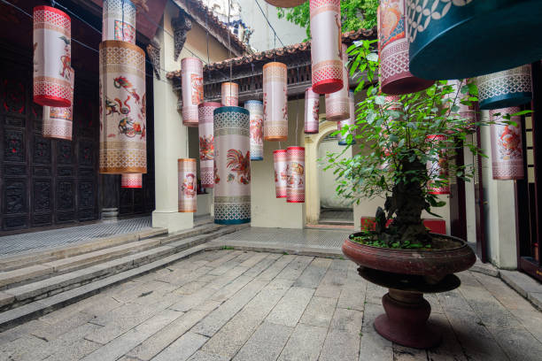 hanoi, vietnam. 5th june, 2023: colorful lanterns are hanging inside a vietnamese temple