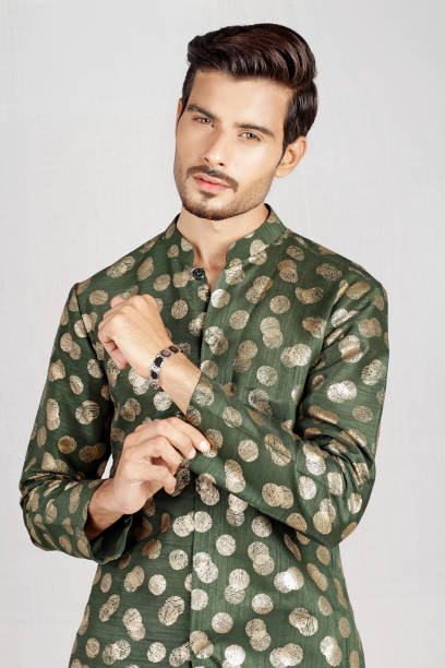 Male model posing in green kurta