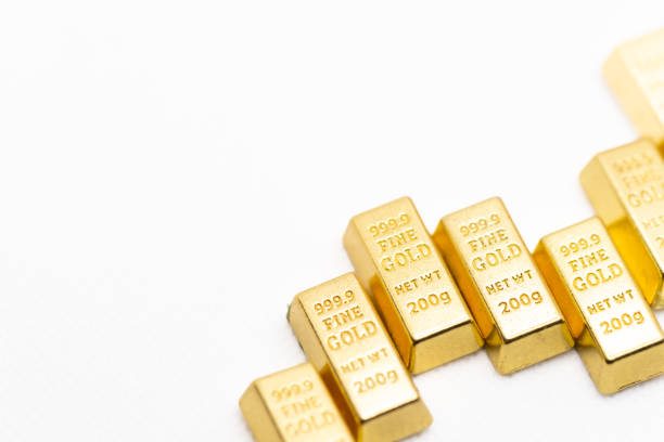 A lot of simulated gold bricks are on the table.Gold bricks representing wealth economic investment