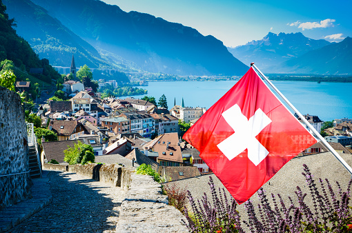 View of the  old town in Montreux, . Flag of Switzerland in front