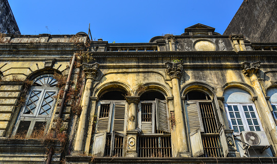 Yangon, Myanmar - Feb 13, 2017. Details of vintage apartment in Yangon, Myanmar. Most Yangon downtown buildings are four-story mix-use (residential and commercial) buildings.