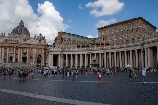 Rome, Italy - August 07, 2023: Photo from St. Peter's Square in Vatican City, there are many people and Christian faithful. Pilgrimage destination.