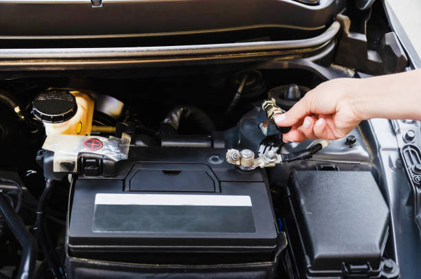 istock disconnecting battery in car before parking for long time. disconnects car battery terminal 1614542934
