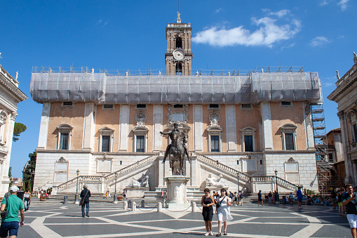 Rome, Italy - August 06, 2023: Photo of Campidoglio in a sunny day with the statue of Marcus Aurelius, people are present.