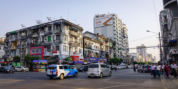 Yangon, Myanmar - Feb 13, 2017. Traffic on street at old town in Yangon, Myanmar. Yangon boasts the largest number of colonial-era buildings in South-east Asia.