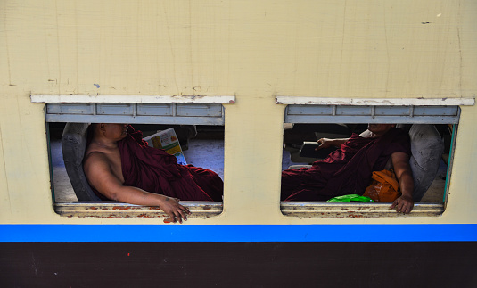 Yangon, Myanmar - Feb 13, 2017. People on the train in Yangon, Myanmar. Yangon is the country main centre for trade, industry and tourism.