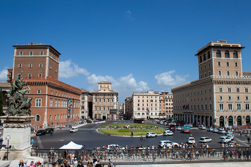 Rome, Italy - August 06, 2023: View of piazza Venezia and Via del Corso in Rome on a sunny day, cars and people are present.