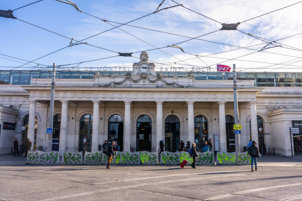 Montpellier, France - January 16 2023 - passengers passing the front of the Gare de Montpellier Saint Roch, train station of Montpellier St Roch.