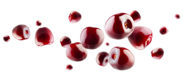 istock Excellent retouched cherry berries fly and levitate in space. Selective focus. Isolated on white 1614687129