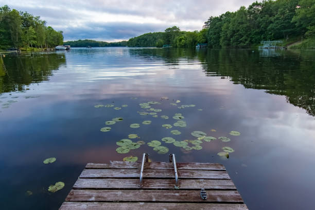 istock Looking down a boat dock on a lake in Northern Wisconsin. 1614693062