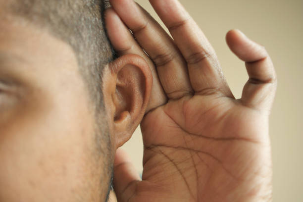 istock young man having ear pain touching his painful ear , 1614754136
