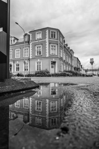 istock reflection in a puddle on a city street 1614756880