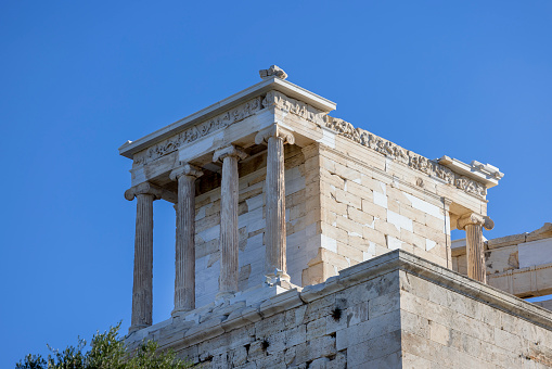 Temple of Athena Nike at Propylaia, monumental ceremonial gateway to the Acropolis of Athens, Greece. It is an ancient citadel located on a rocky slope above the city