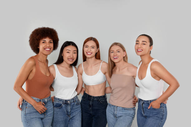 istock Group of beautiful young women on light grey background 1614762803