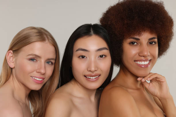istock Portrait of beautiful young women on light grey background 1614763921