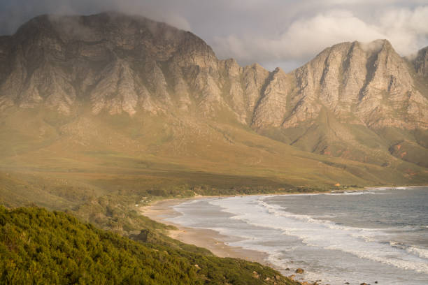 istock Coastal mountains with the ocean 1614767684