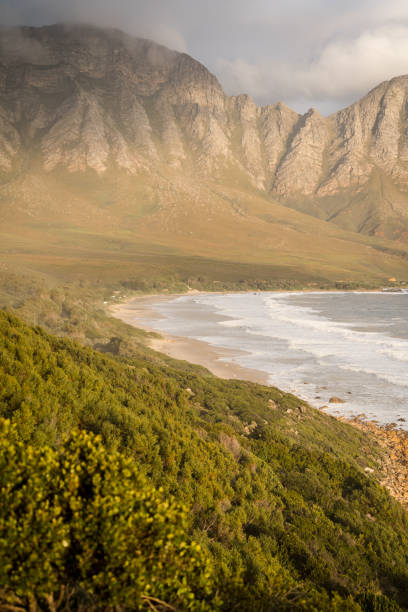 istock Coastal mountains with the ocean 1614767701