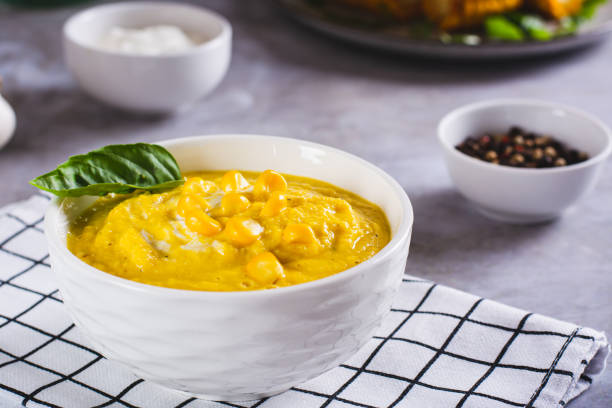 istock Delicious corn cream soup in a bowl on the table 1614773128