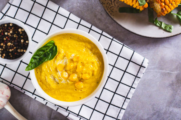 istock Delicious corn cream soup in a bowl on the table top view 1614773656