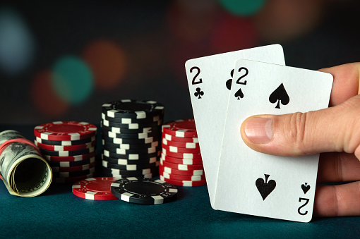 Poker cards with one pair combination in the player hand. Lucky combination in a game in a poker club. Winning depends on luck.