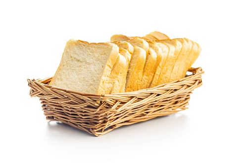 White sliced toast bread in basket isolated on the white background.