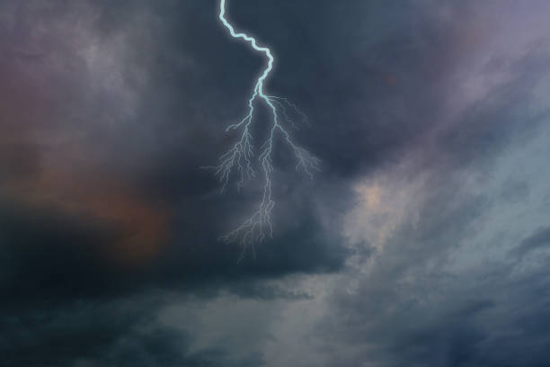 istock dramatic stormy sky with dark clouds, lightning flashes over the night sky. Concept on the theme of Severe Weather, natural disasters, hurricane, typhoon, tornado, storm, natural basis for designer 1614862403