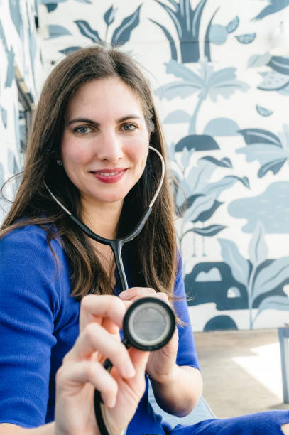 istock Patient point of view, doctor with stethoscope performing a routine exam 1614870108