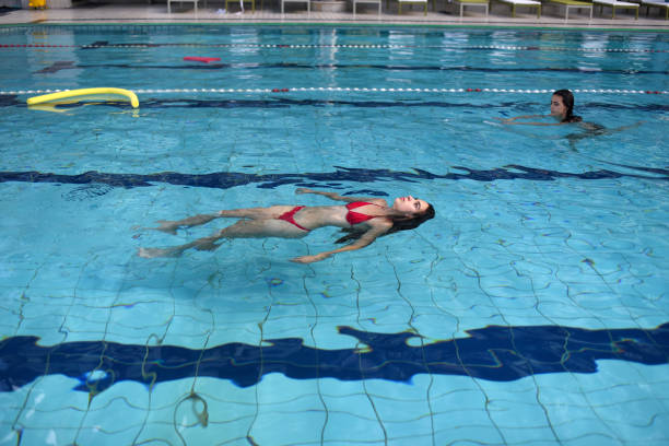 girls floating in the pool