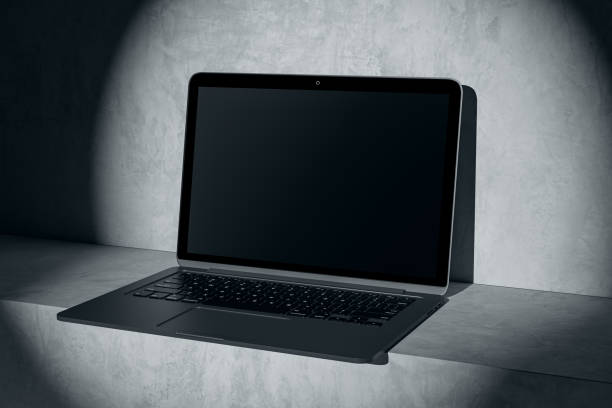 istock Close up of blank computer in spotlight. Mock up place on screen and advertisement concept. 3D Rendering. 1614935120