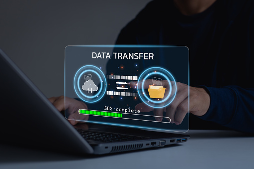 Data center security file document transfer and Database management cloud computing concept. Businessman transfer data online through security systems in a business workspace. Download and upload data