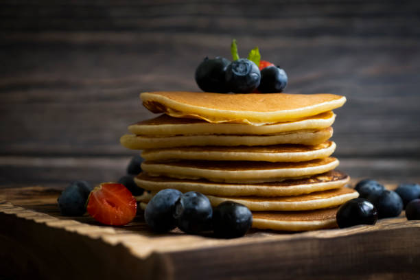 istock Pancakes with blueberries and strawberries 1615023438