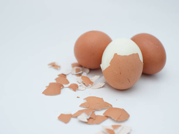 istock three boiled chicken eggs isolated on white, one of which is peeled 1615044972