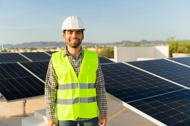 istock Happy solar panel installer at a residential home 1615143721
