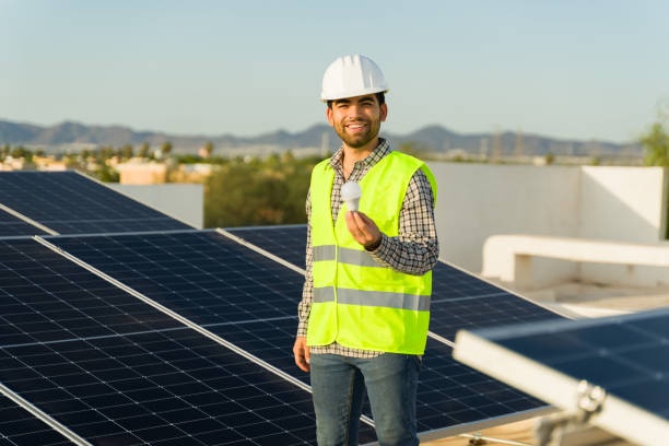 istock Hispanic engineer with a lighting a light bulb with sustainable energy 1615144953