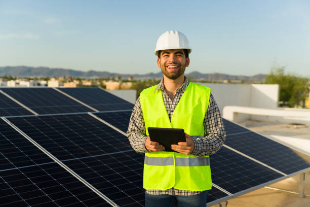 istock Attractive engineer installing solar panels and clean energy 1615145968