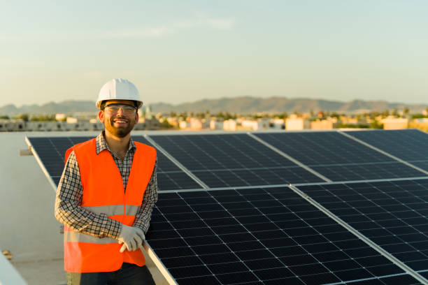istock Cheerful man happy about working with solar panels 1615150631