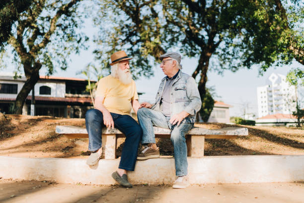 istock Senior men talking in the park 1615162463