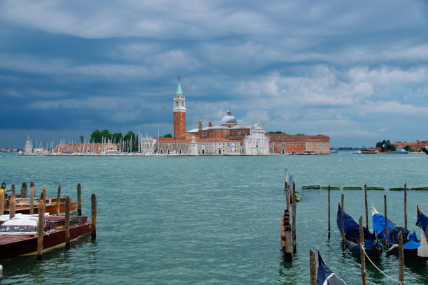 Church of San Giorgio Maggiore viewed from Venice with dramatic sky stock photo