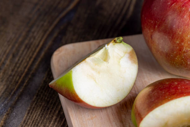 istock Sliced ripe apple of red color 1615194906