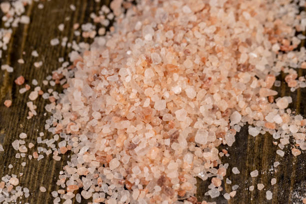 istock Pink natural salt on the table, close up 1615196333
