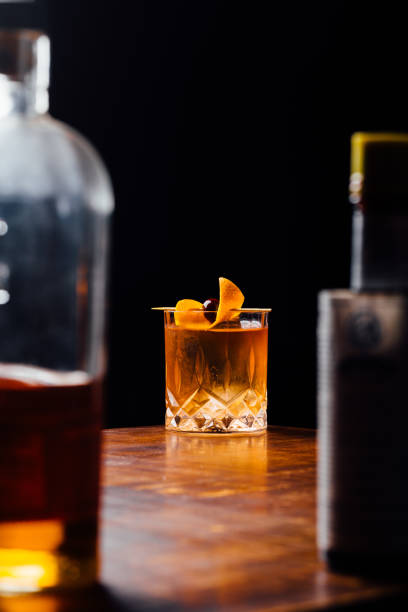 istock Alcoholic Old Fashioned Cocktail classic Bourbon Whiskey, sugar cube and aromatic bitters garnish with orange peel and a cherry 1615246812