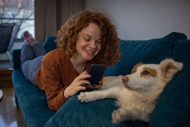 istock Happy young woman using phone 1615283772