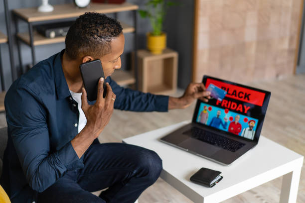istock Black Friday discounts on a man's laptop 1615290270