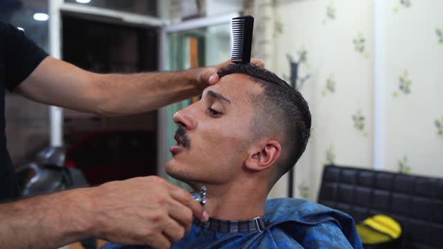 Men's hair salon. Single man getting personal grooming. Single life. Barbershop for men.