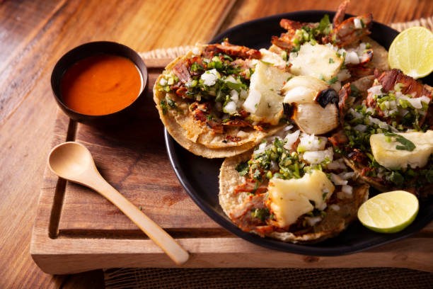 istock Mexican al pastor tacos with pineapple 1615397946